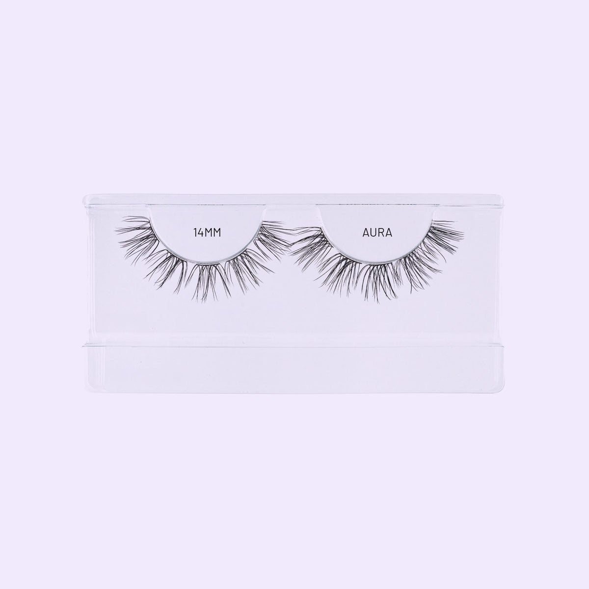 Aura NanoSoft 14mm lash clusters in a clear tray against a soft lilac background.