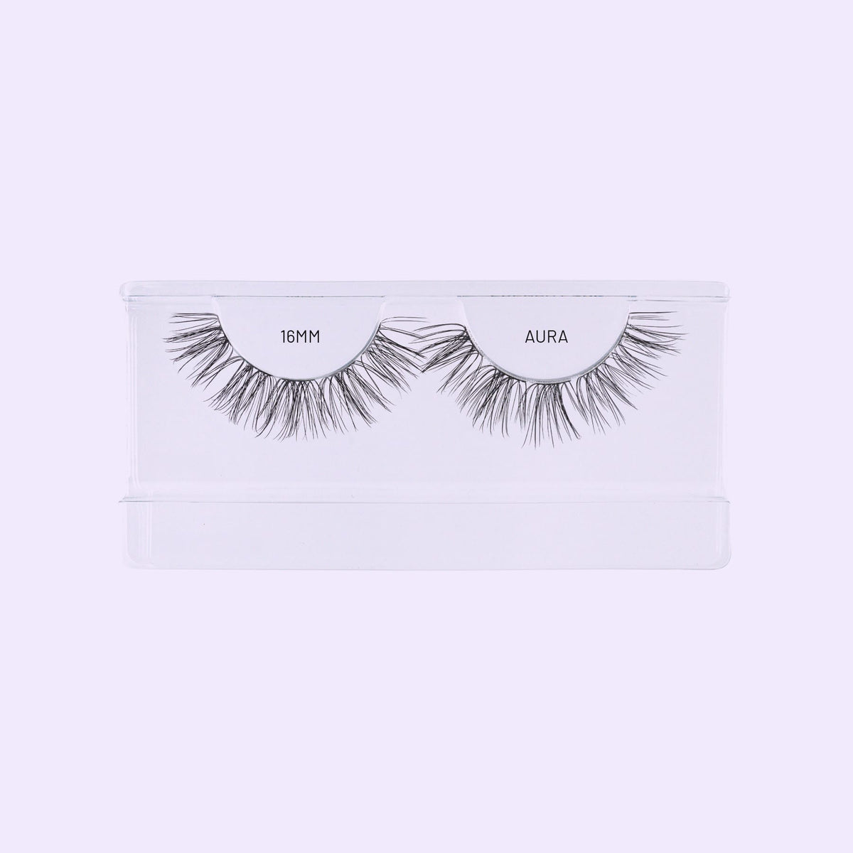 Lilac St. Aura NanoSoft 16mm lash clusters arranged in a clear tray against a pale lilac background.