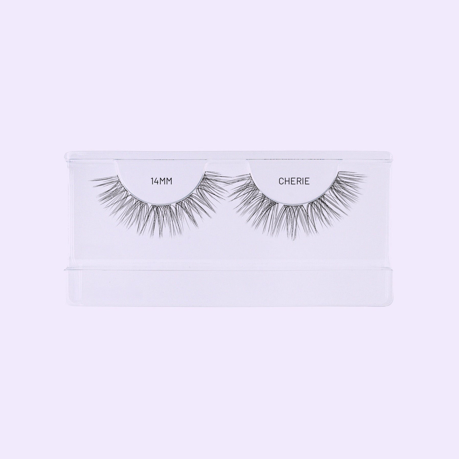 Lilac St. Cherie 14mm NanoSoft lash clusters arranged in a clear tray against a soft lilac background.