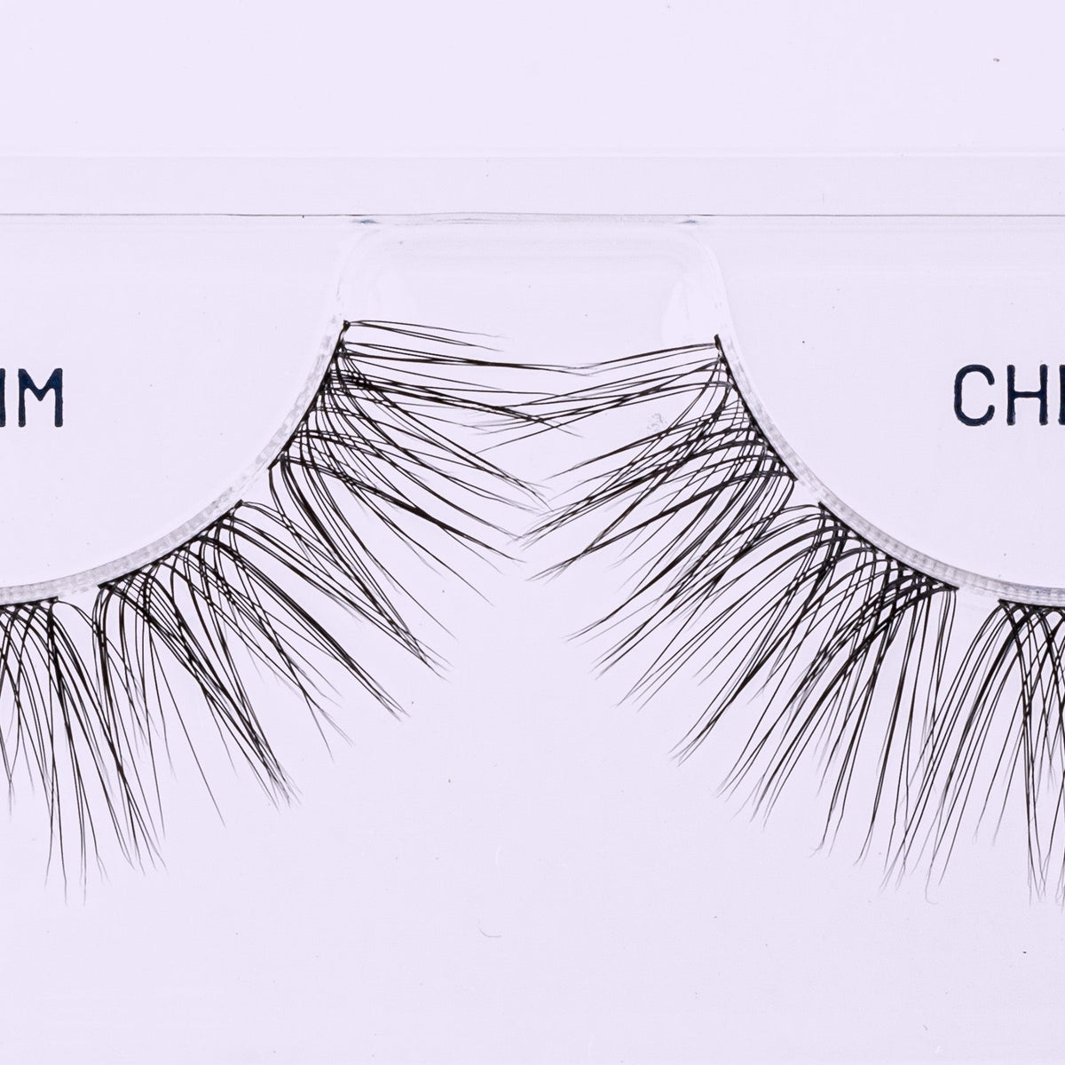 Cherie NanoSoft 14mm lash clusters arranged in a Lilac St. tray, showing tapered fibers and varied lengths.