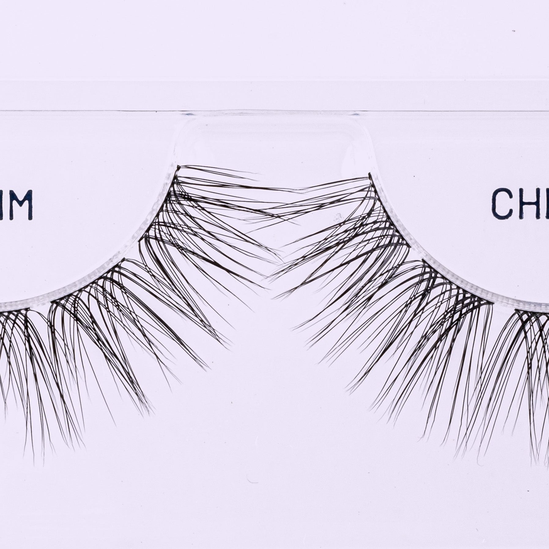 Cherie NanoSoft 14mm lash clusters arranged in a Lilac St. tray, showing tapered fibers and varied lengths.