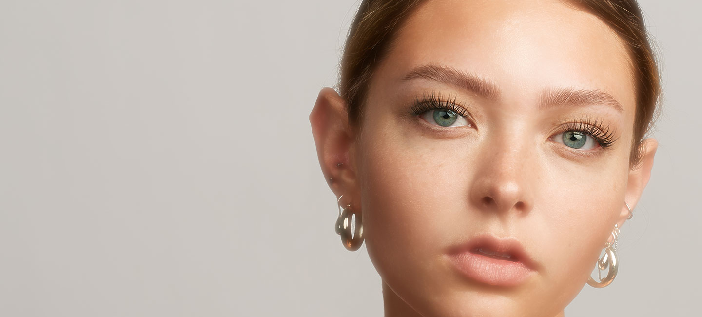 close-up of a woman wearing wispy lash extensions